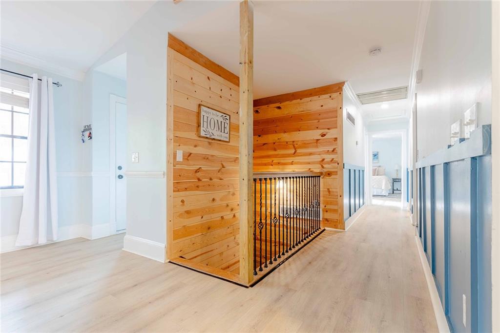6375 Caladium Drive Acworth, GA 30102 - Photo 19 of 41 a view of a hallway with wooden floor and door