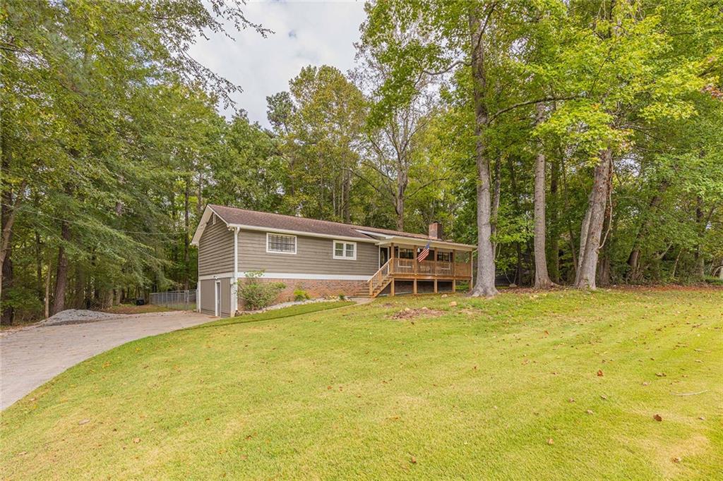 6375 Caladium Drive Acworth, GA 30102 - Photo 2 of 41 a view of a swimming pool with a yard