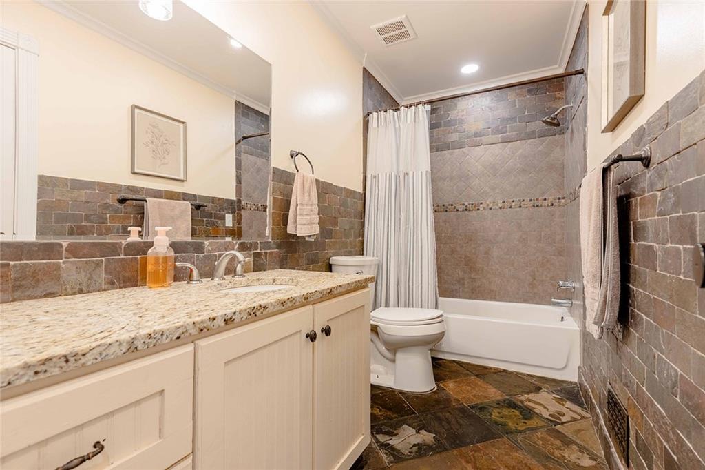 6375 Caladium Drive Acworth, GA 30102 - Photo 30 of 41 a bathroom with a granite countertop sink toilet and shower