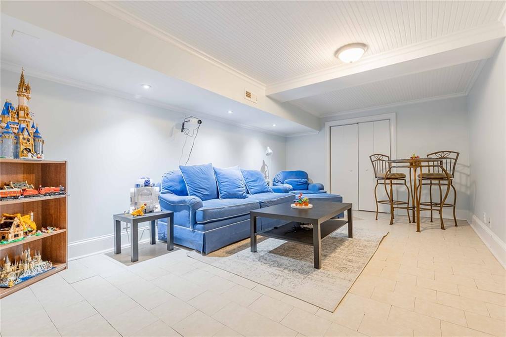 6375 Caladium Drive Acworth, GA 30102 - Photo 31 of 41 a living room with furniture a table and a bookshelf