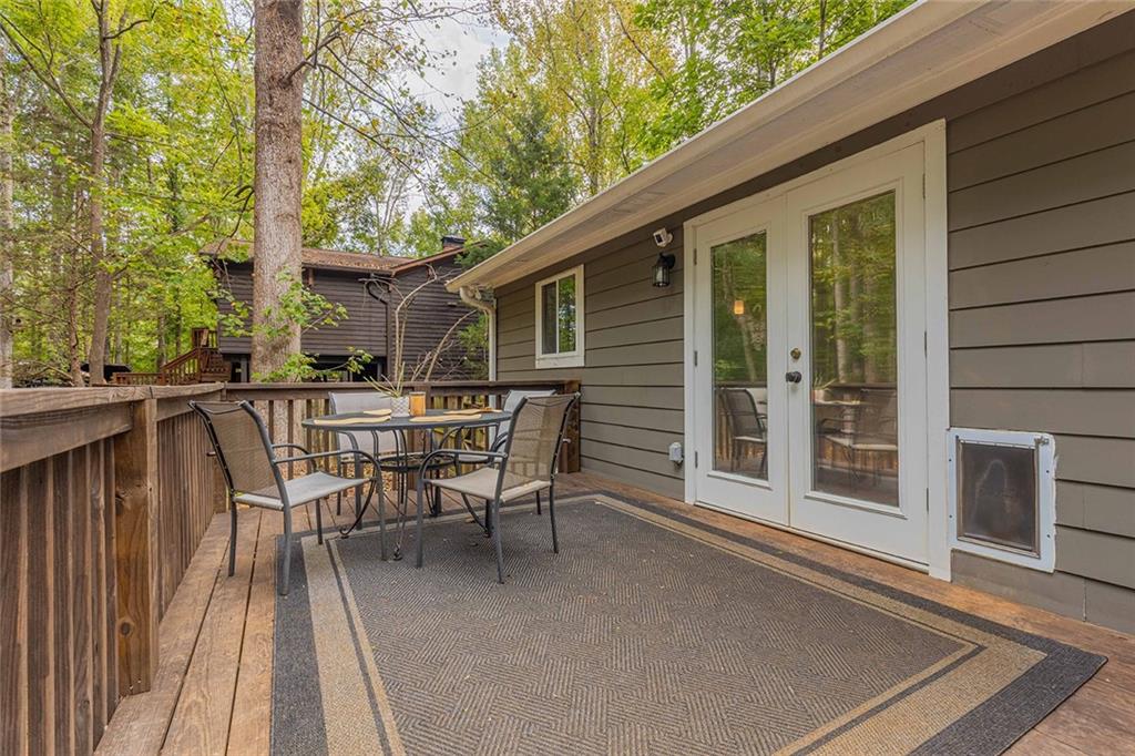 6375 Caladium Drive Acworth, GA 30102 - Photo 35 of 41 a view of a patio with a table and chairs