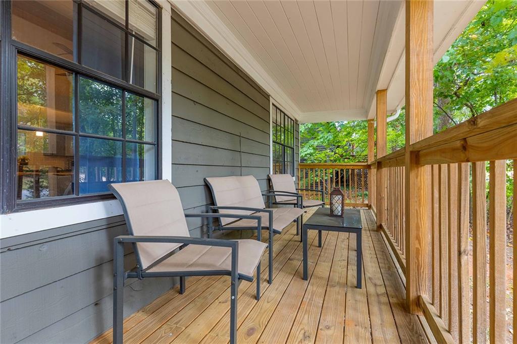 6375 Caladium Drive Acworth, GA 30102 - Photo 7 of 41 a view of balcony with chairs and wooden floor