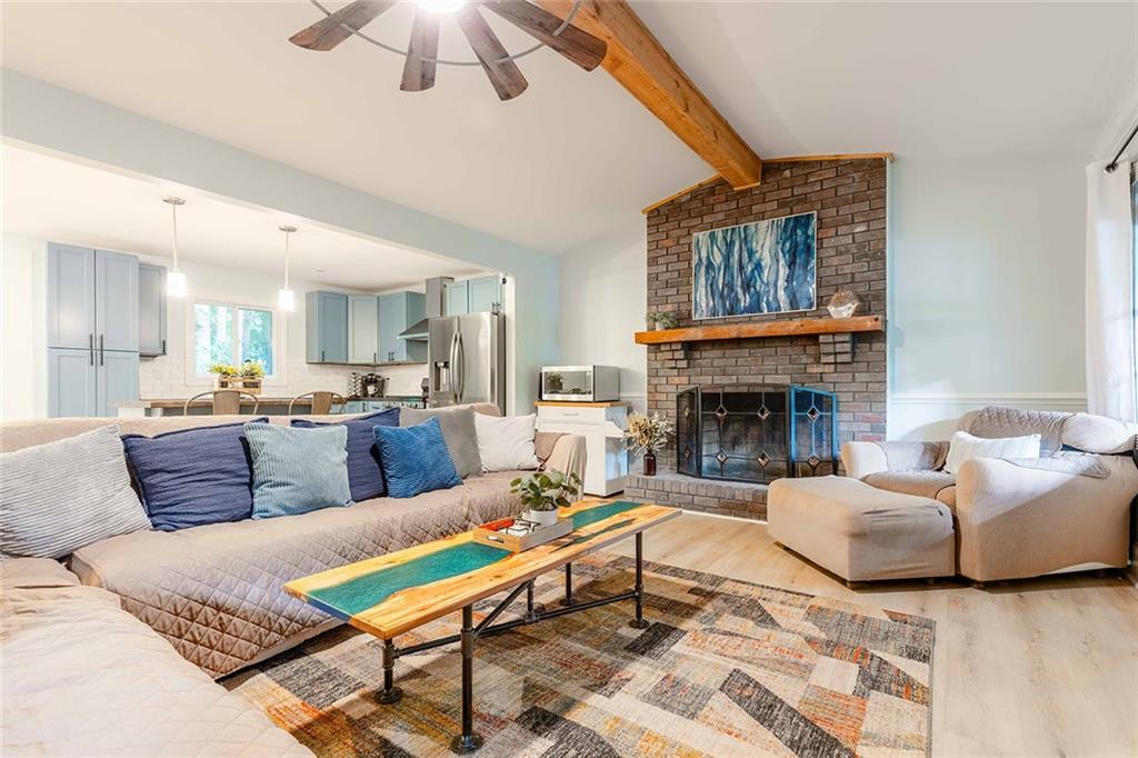 6375 Caladium Drive Acworth, GA 30102 - Photo 9 of 41 a living room with furniture fireplace and window