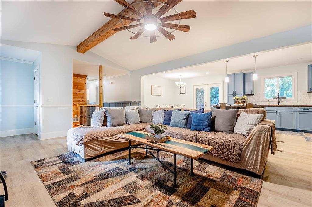6375 Caladium Drive Acworth, GA 30102 - Photo 10 of 41 a living room with furniture and a chandelier