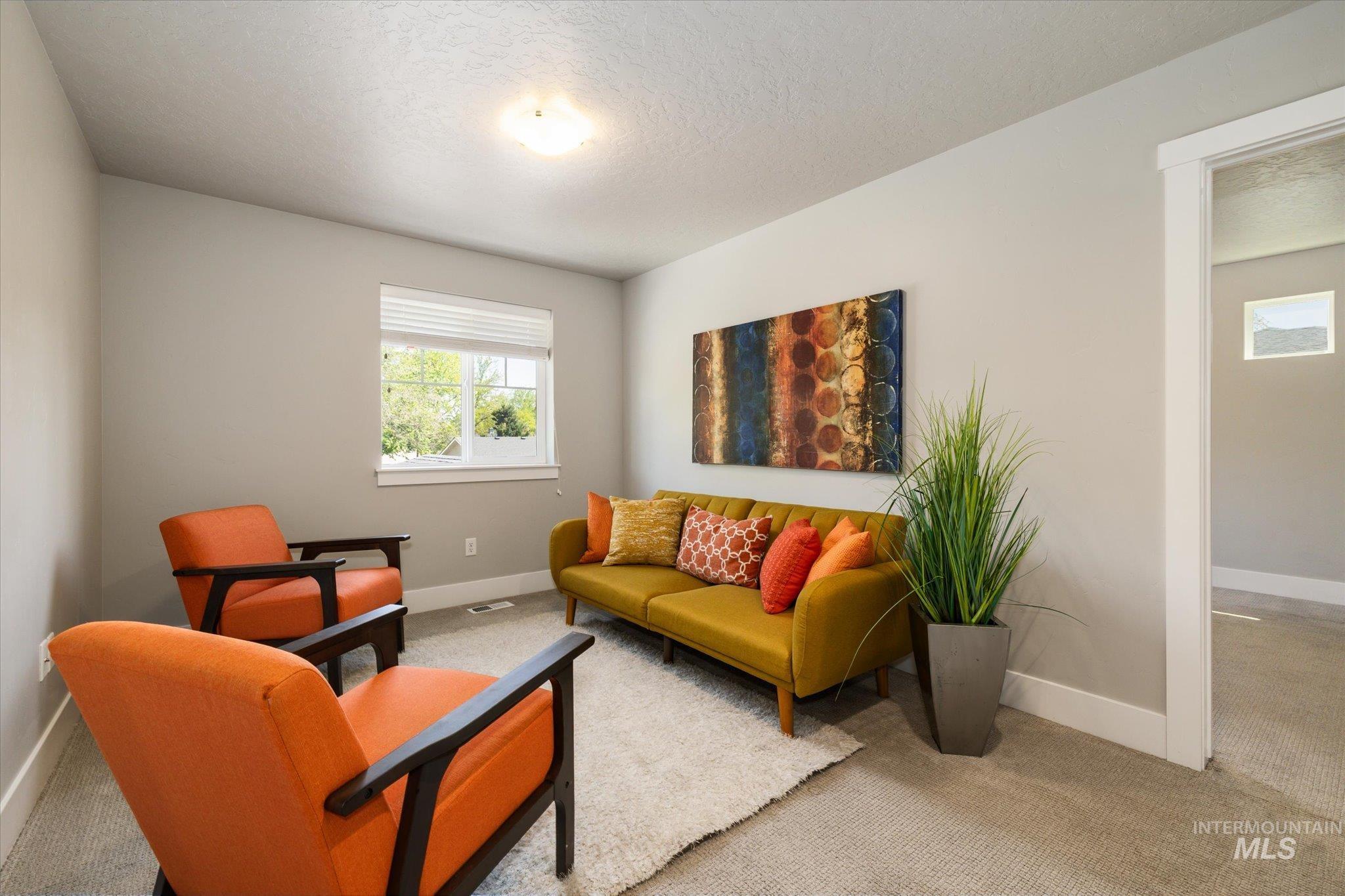 1915 South High Street Boise, ID 83706 - Photo 26 of 44 Carpeted room featuring light gray walls, white trim, a single window with blinds, and an overhead flush-mount light fixture