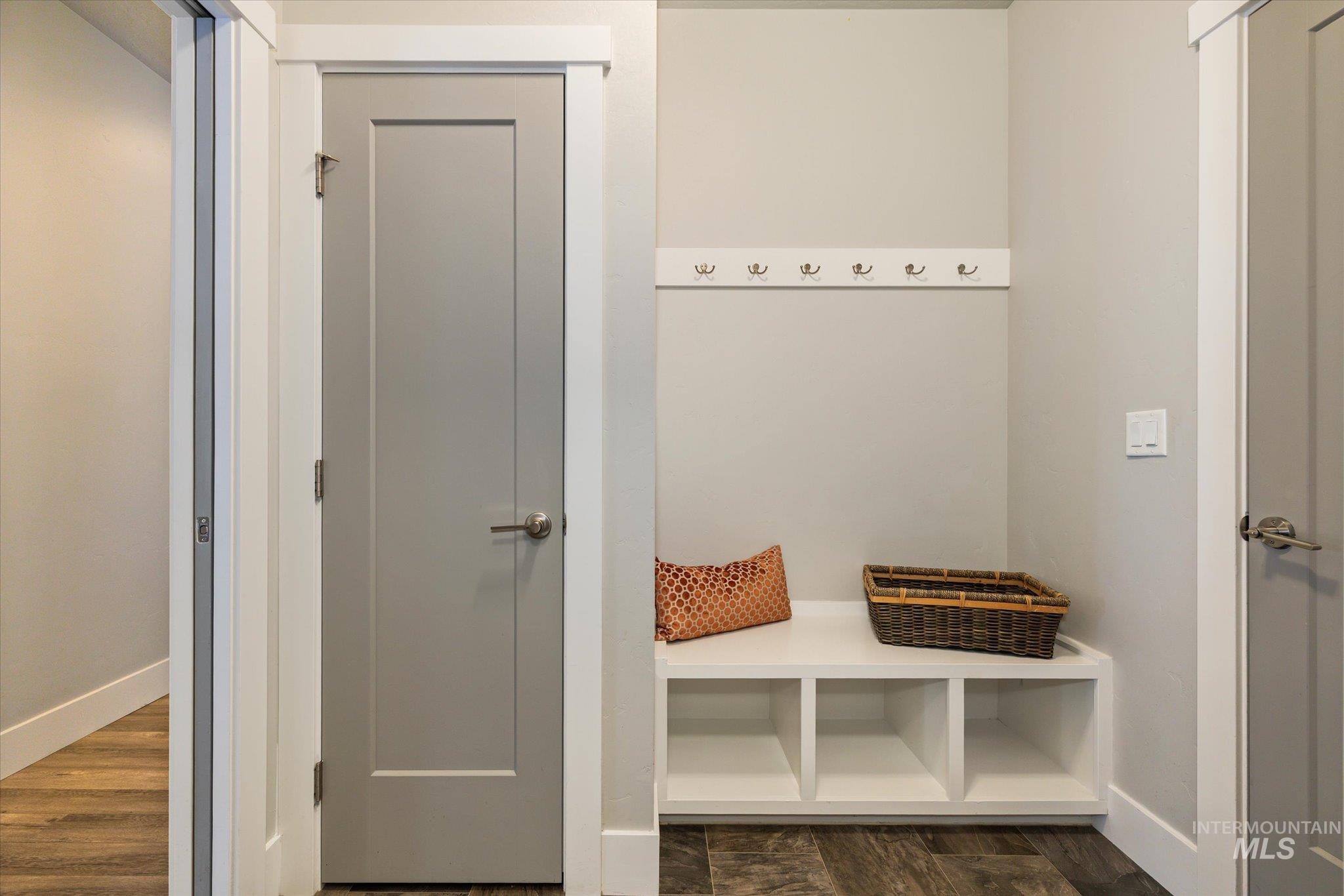 1915 South High Street Boise, ID 83706 - Photo 10 of 44 Entryway featuring built-in bench seating with cubbies, an overhead coat rack, and flat-panel interior doors