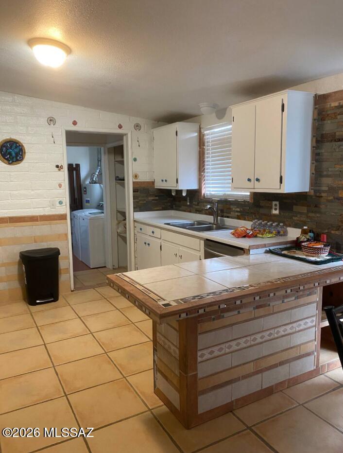 4415 North Swan Road Tucson, AZ 85718 - Photo 14 of 33 a kitchen with stainless steel appliances granite countertop a stove a sink and a refrigerator