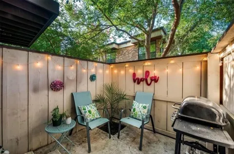 a view of a swimming pool with an outdoor space and seating area