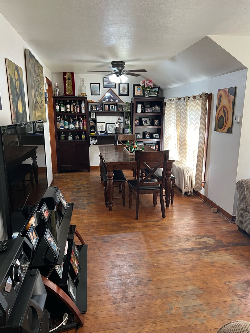 1449 Main Street Crete, IL 60417 - Photo 4 of 4 a view of a dining room with furniture and wooden floor