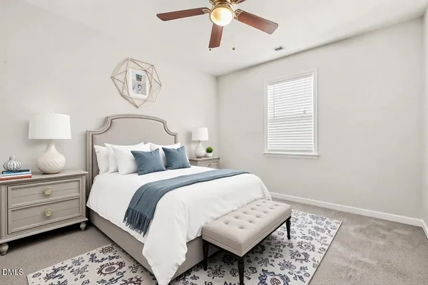 a bed room with a bed and a chandelier