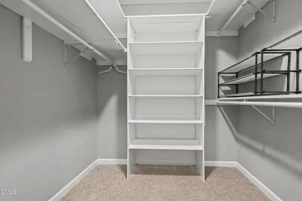 a view of an empty walk in closet