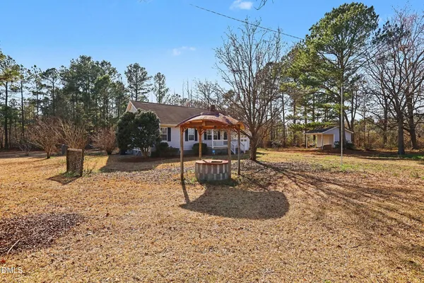 a house with trees in the background