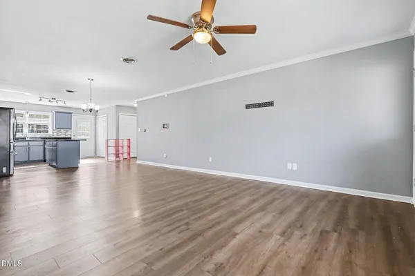 a view of a kitchen with a stove cabinets and wooden floor