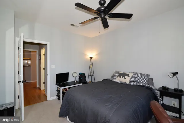 a bedroom with a bed and a tv