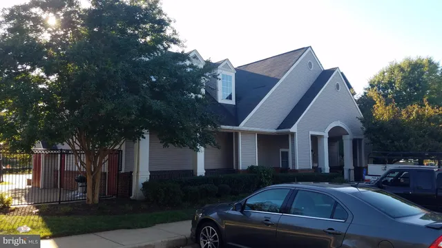 a front view of house with yard and trees