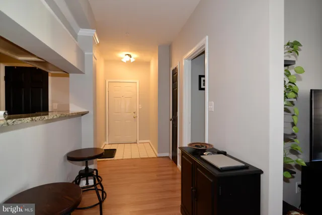 a view of a livingroom with furniture and a flat screen tv