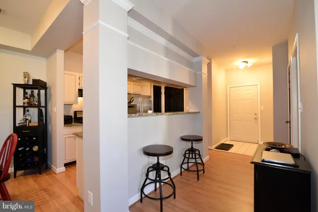 a view of a livingroom with furniture and gym equipment