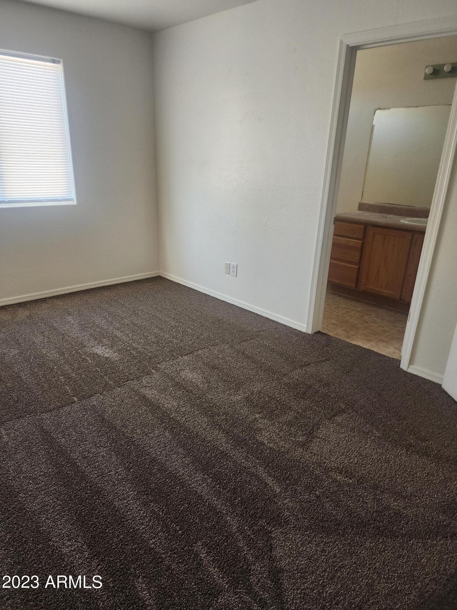 14097 South Berwick Road, Unit C Arizona City, AZ 85123 - Photo 7 of 8 a view of an empty room