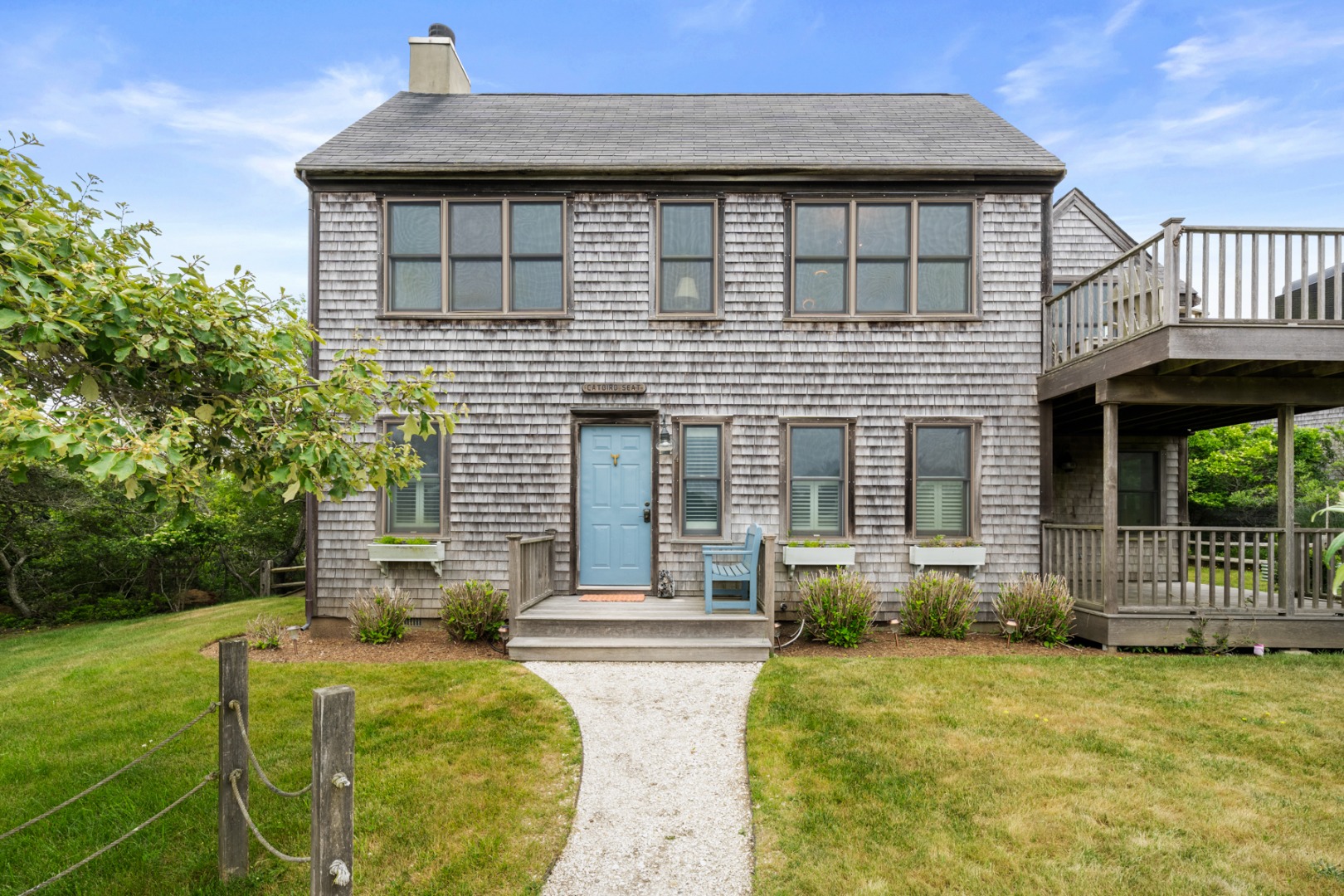 4 Berkley Street Nantucket, MA 02554 - Photo 40 of 47 a front view of a house with a yard