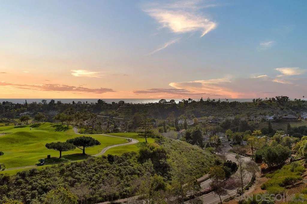 1375 Ravean Court Encinitas, CA 92024 - Photo 1 of 73 a view of a lake with a mountain in the background