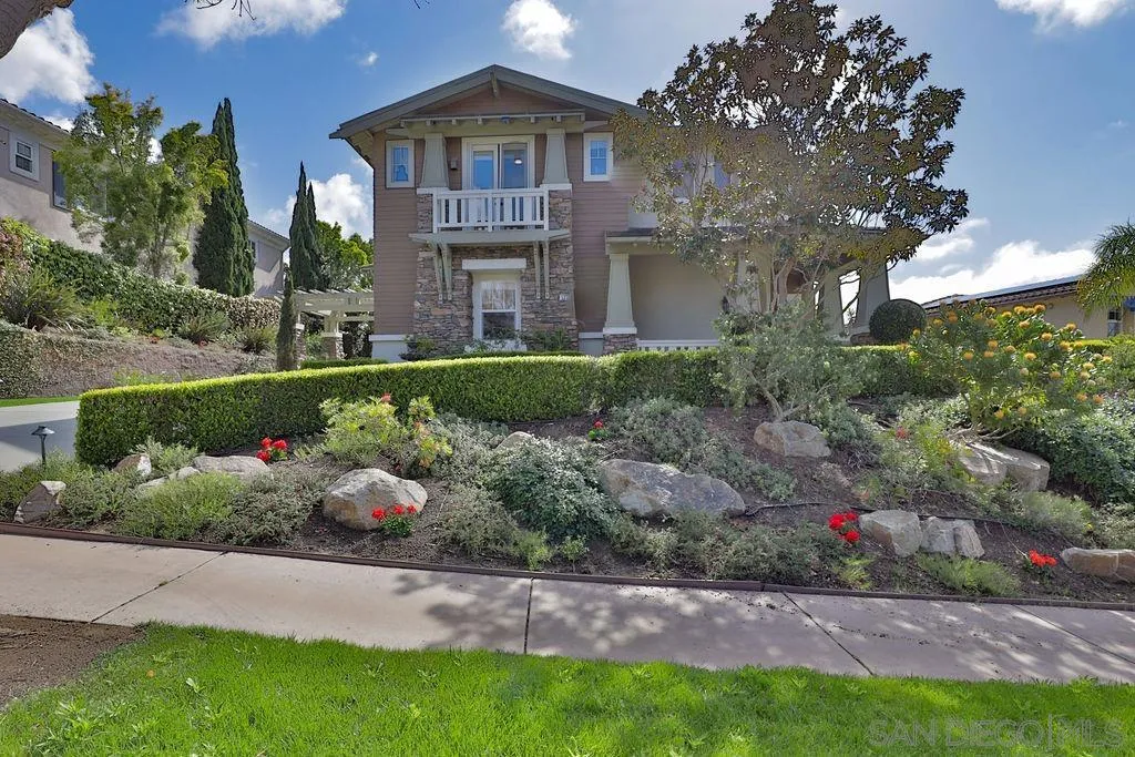 1375 Ravean Court Encinitas, CA 92024 - Photo 13 of 73 a front view of a house with a yard and potted plants