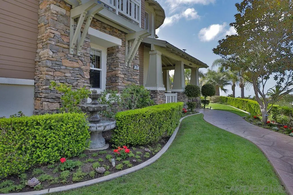 1375 Ravean Court Encinitas, CA 92024 - Photo 14 of 73 a view of a house with a backyard and garden