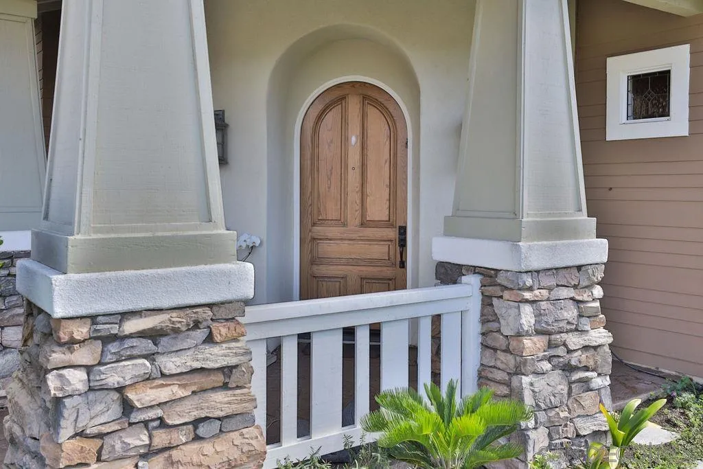 1375 Ravean Court Encinitas, CA 92024 - Photo 19 of 73 a front view of a house with a garden
