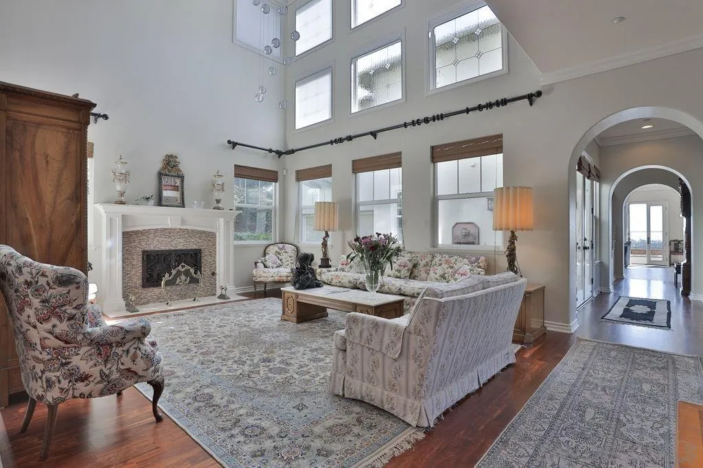 1375 Ravean Court Encinitas, CA 92024 - Photo 24 of 73 a living room with furniture a fireplace and a table