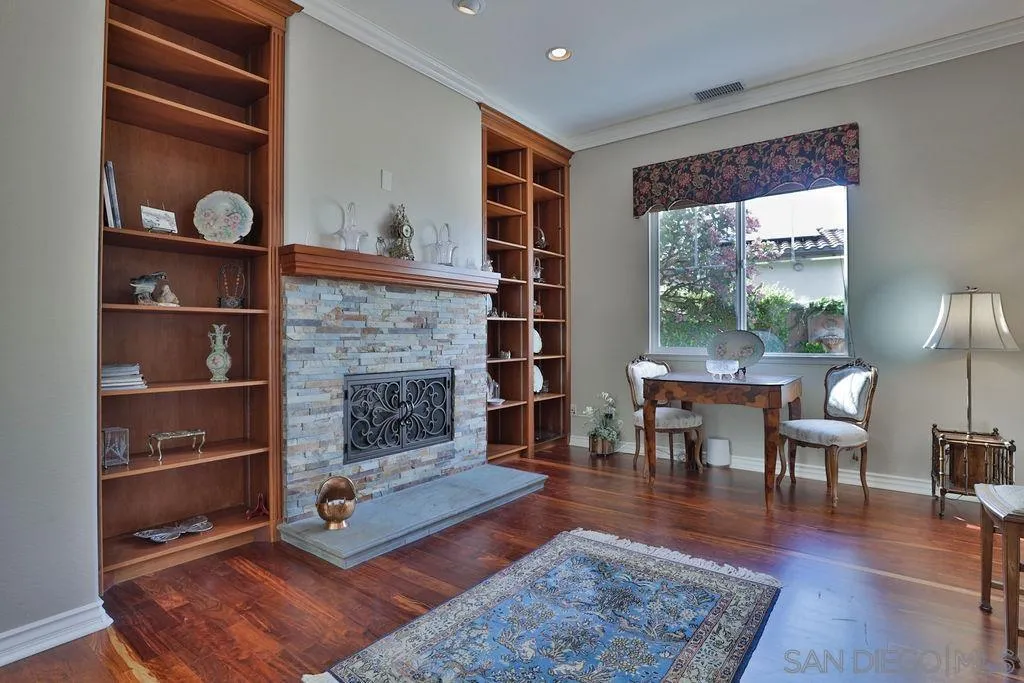 1375 Ravean Court Encinitas, CA 92024 - Photo 26 of 73 a living room with furniture and a fireplace