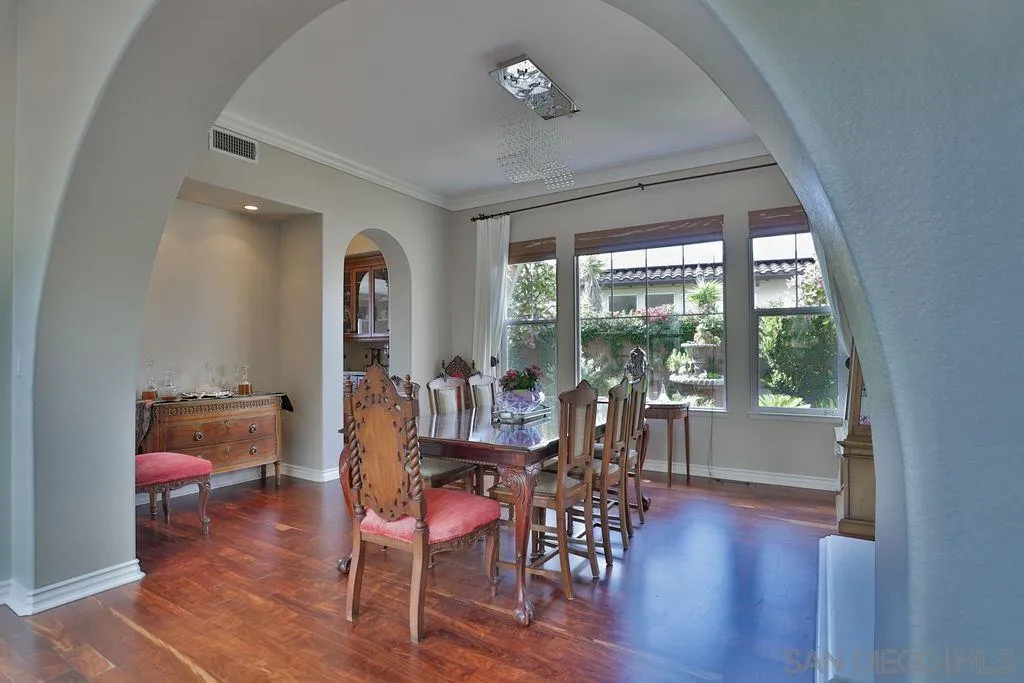 1375 Ravean Court Encinitas, CA 92024 - Photo 27 of 73 a view of a dining room with furniture window and wooden floor