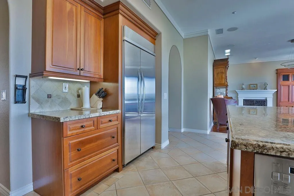 1375 Ravean Court Encinitas, CA 92024 - Photo 35 of 73 a kitchen with granite countertop a stove and a sink