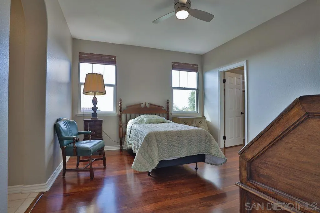 1375 Ravean Court Encinitas, CA 92024 - Photo 48 of 73 a bedroom with a bed and chair