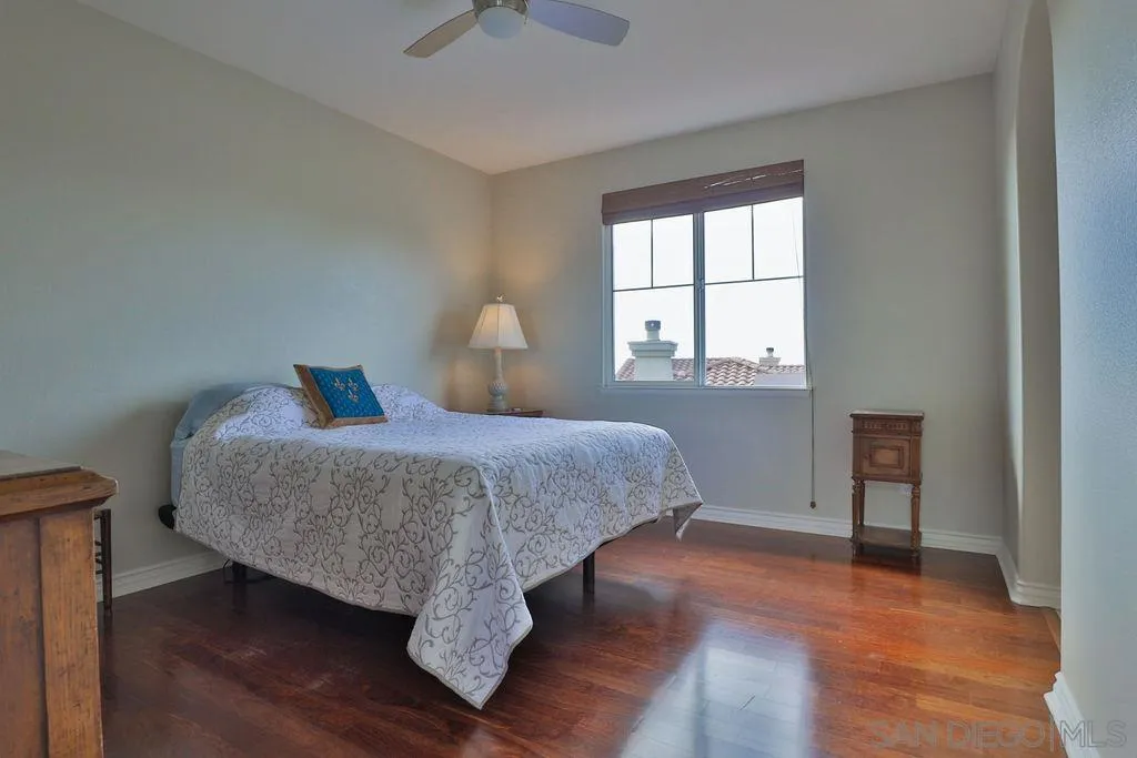 1375 Ravean Court Encinitas, CA 92024 - Photo 49 of 73 a bedroom with a bed and window
