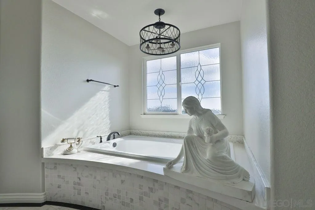 1375 Ravean Court Encinitas, CA 92024 - Photo 53 of 73 a bathroom with a sink and a mirror