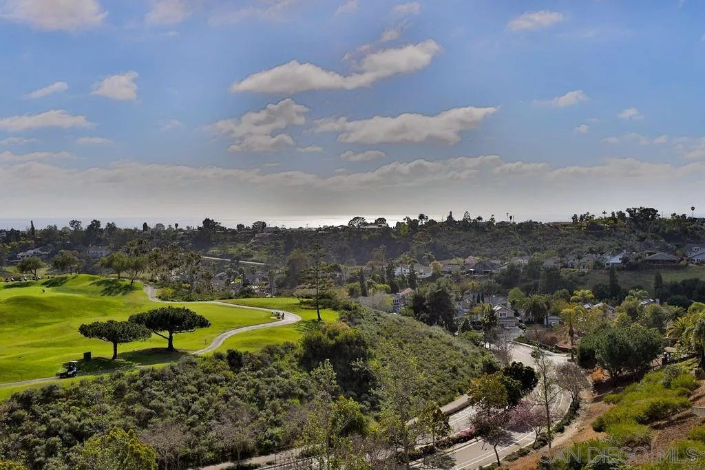 1375 Ravean Court Encinitas, CA 92024 - Photo 61 of 73 a view of a golf course with a lake view