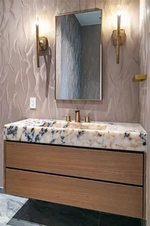 a view of bathroom with granite countertop
