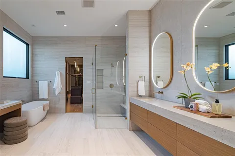 a bathroom with a double vanity sink and a mirror