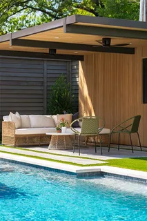 a view of swimming pool with seating area