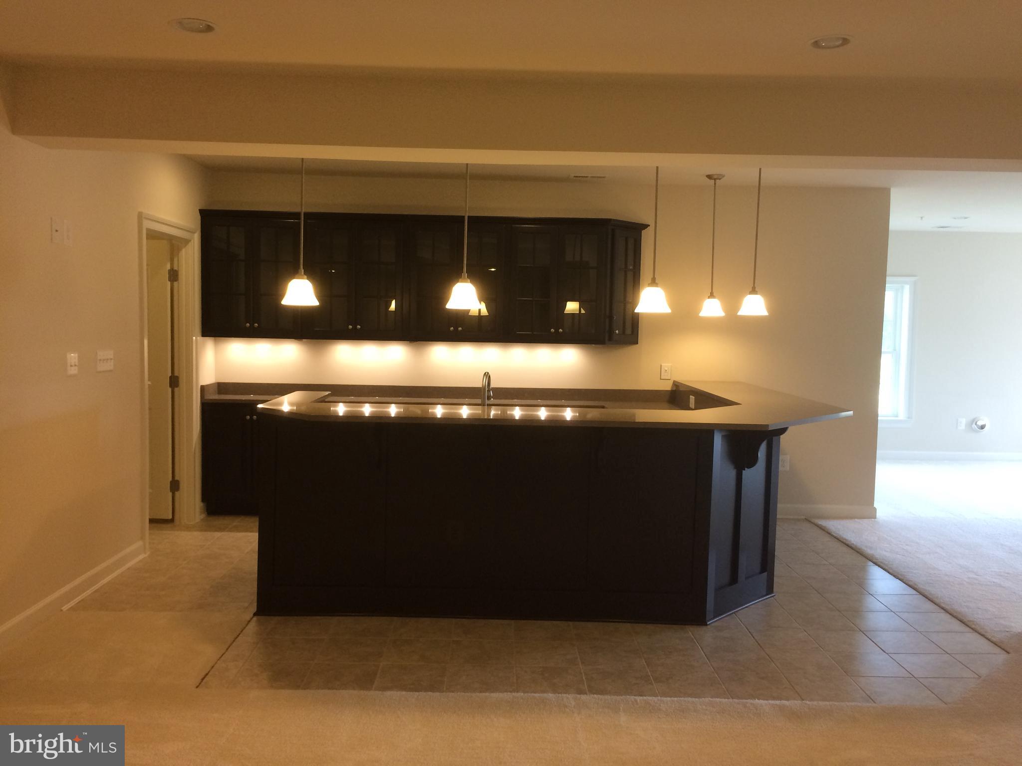 515 Parkland Road Eldersburg, MD 21784 - Photo 15 of 18 a room with a projector and screen