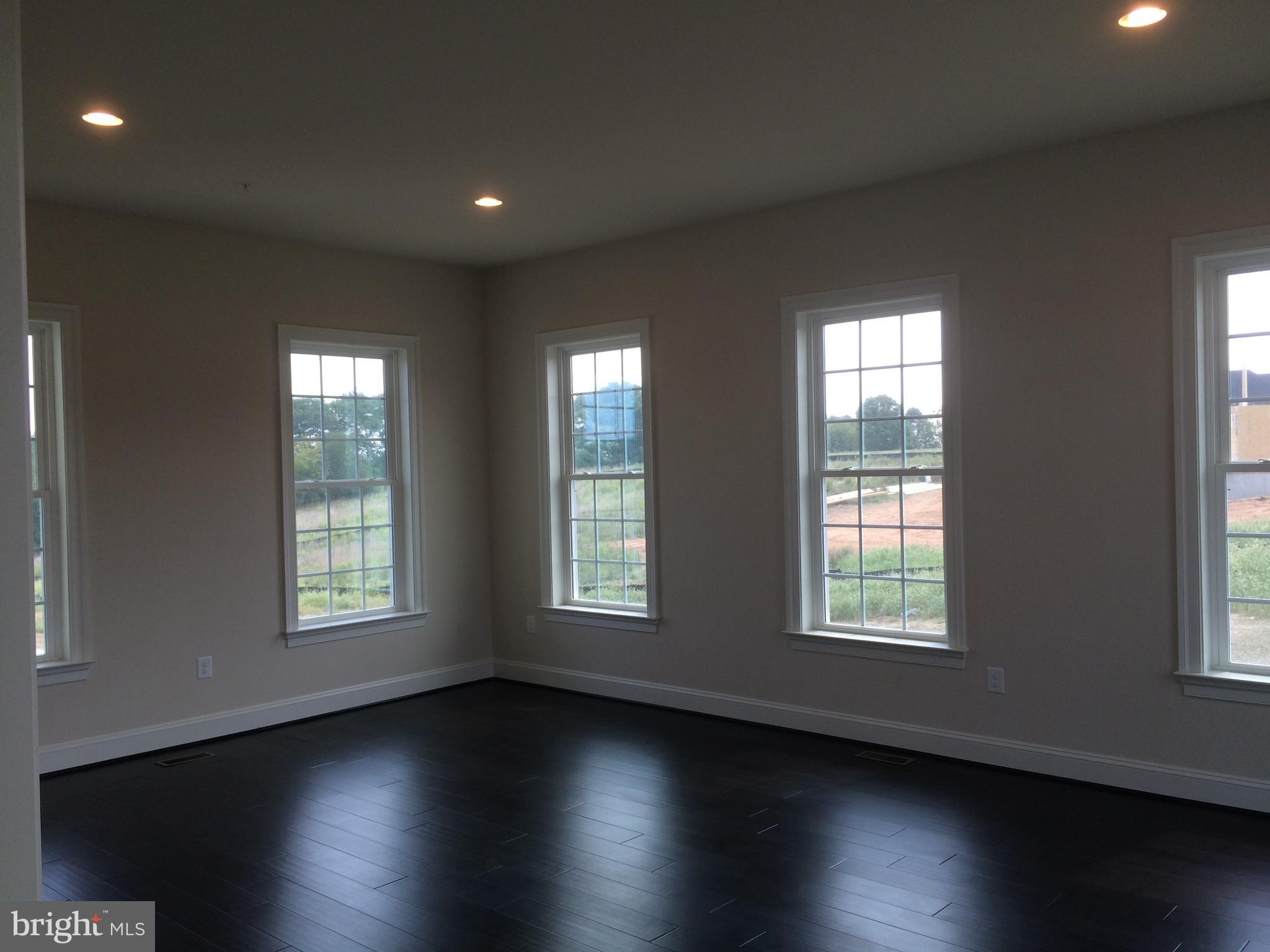 515 Parkland Road Eldersburg, MD 21784 - Photo 18 of 18 a view of an empty room with wooden floor and a window