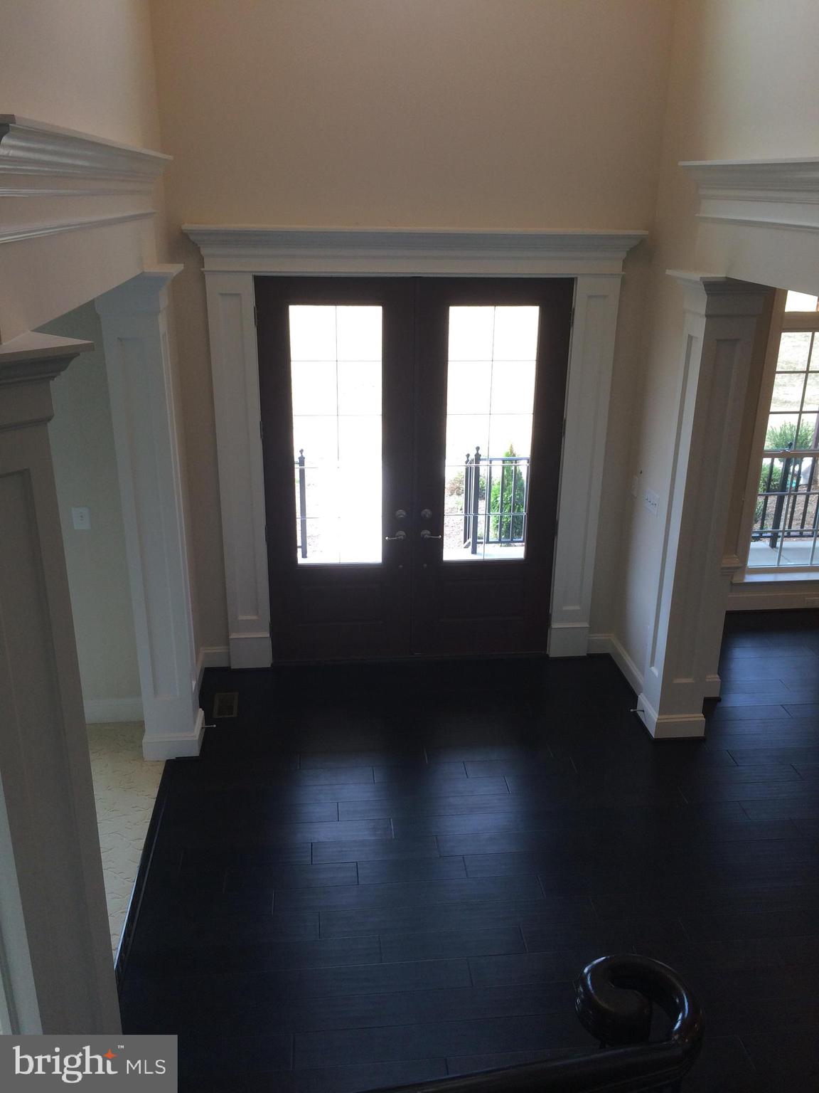 515 Parkland Road Eldersburg, MD 21784 - Photo 3 of 18 a view of an empty room with wooden floor and a window