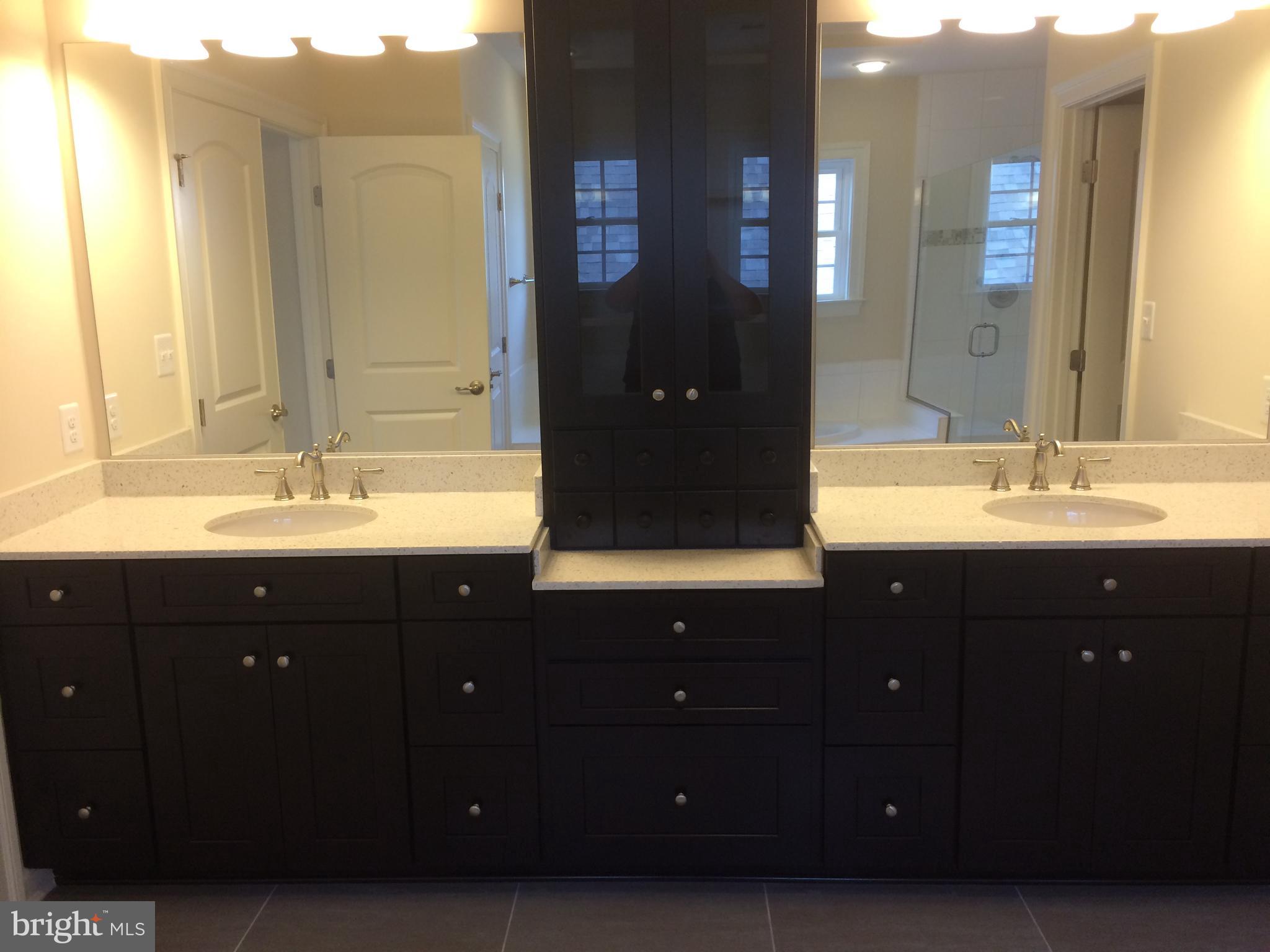 515 Parkland Road Eldersburg, MD 21784 - Photo 9 of 18 a bathroom with a sink vanity and a mirror