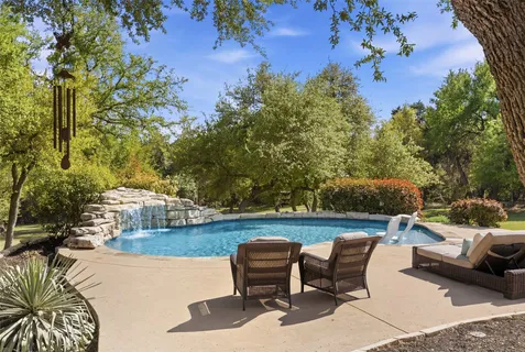 a view of a chairs and table in the patio