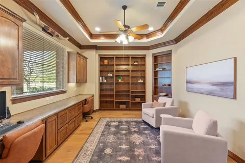 a spacious bedroom with a bed and a large window