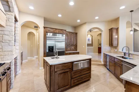 a view of living room with granite countertop furniture and fireplace