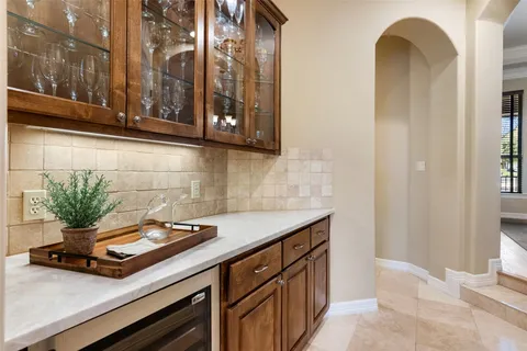 a kitchen with a sink and a mirror