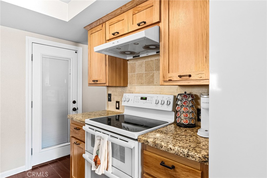 3985 Front Street Chico, CA 95928 - Photo 12 of 55 a kitchen with stainless steel appliances granite countertop a sink and cabinets
