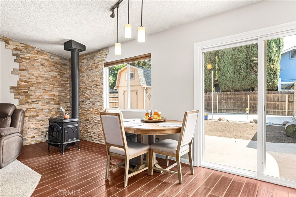 3985 Front Street Chico, CA 95928 - Photo 14 of 55 a dining room with furniture a chandelier and wooden floor