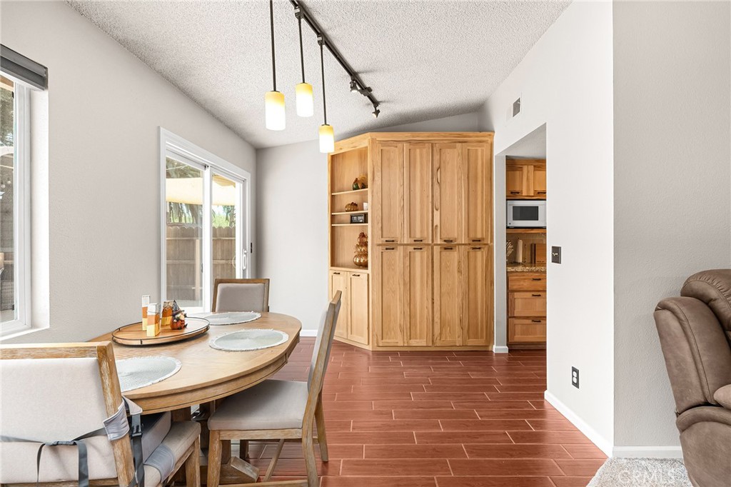 3985 Front Street Chico, CA 95928 - Photo 15 of 55 a view of a dining room with furniture window and wooden floor