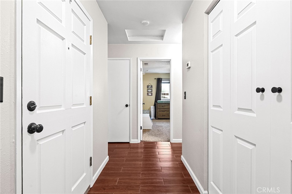 3985 Front Street Chico, CA 95928 - Photo 16 of 55 a view of a hallway with wooden floor and closet area